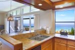 The kitchen is fully stocked with everything you need- plus ocean views